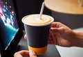 Close-up of a hand holding a paper cup with coffee, mockup illustration for design, Royalty Free Stock Photo