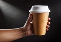 Close-up of a hand holding a paper cup with coffee, mockup illustration for design, Royalty Free Stock Photo