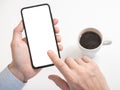 Close-up hand holding phone mobile blank screen and finger touching, in coffee shop. Cell phone mockup Royalty Free Stock Photo