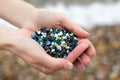 Close Up Of Hand Holding Plastic Granules Polluting Beach