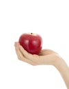 Close up of hand holding a red apple