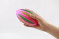 Close up hand holding Rugbyball on white background Royalty Free Stock Photo