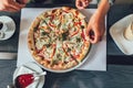 Close-up of  hand holding slice of pizza Royalty Free Stock Photo