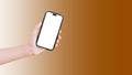 Close-up of hand holding smartphone with blank on screen isolated on background of brown