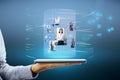 Close up of hand holding tablet with abstract digital cylinder picture hologram on blue background. Computer, technology, Royalty Free Stock Photo