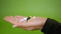 Close-up hand holding variety colorful pills on palm. Arm reveals, shows pills Royalty Free Stock Photo