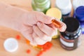 Close up of hand is holding a vitamin supplement