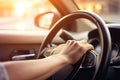 Close up hand holing or controlling steering wheel of car for driving, point of view inside car, on the highway road, with Royalty Free Stock Photo