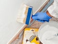 House painter at work painting a wall with a brush Royalty Free Stock Photo