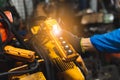 Close up hand of industrial man holding and pressing up and down switch button remote control. Royalty Free Stock Photo