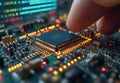 Close-up of a hand inserting a microchip on a computer circuit board