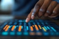 close up of a dark skinned hand interacting with a digital touchscreen displaying colorful bar graphs and data visualization Royalty Free Stock Photo