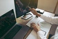 Close up of hand investors are pointing to laptop computer that have investment information stock markets and partners taking Royalty Free Stock Photo