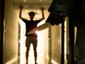 Close up of Hand with knife following young terrified in the apartment. man Bandit is holding a knife in hand, Threat Concept, Royalty Free Stock Photo