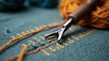 Close-up of hand knitting tools with blue and yellow yarn on fabric Royalty Free Stock Photo