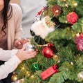 Little girl decorate christmas tree with ornament Royalty Free Stock Photo
