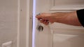 Close Up of Hand Locking the Door of House Royalty Free Stock Photo