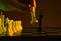 Close-up hand makes a move, check and checkmate, chess, chessboard, game, confrontation. career, promotion, startup crisis