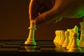 Close-up hand makes a move, check and checkmate, chess, chessboard, game, confrontation. career, promotion, startup crisis