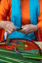 Close up of hand making spousal cake Phu The for wedding traditional in Vietnam. Food and culture concept