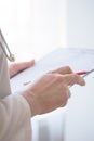 Close up Of Hand Male Doctor Filling The Medical Form. Close-up Of Male Doctor Filling The Medical Form. Doctor writting. Uniform Royalty Free Stock Photo