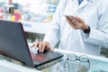 Close up hand of a male pharmacist working at pharmacy. Medical healthcare concept Royalty Free Stock Photo