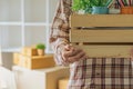 Close up of hand a man carrying box for moving into new apartment. relocation move home concept