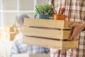 Close up of hand a man carrying box for moving into new apartment. relocation move home concept