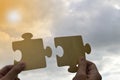 Close up hand of man connecting jigsaw puzzle with sunlight effect Royalty Free Stock Photo