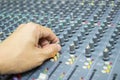 Close-up hand of man control Mixing Console of a big HiFi system The audio equipment Royalty Free Stock Photo