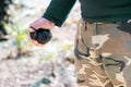 Close up on the hand of a man holding a grenade Royalty Free Stock Photo