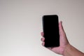 Close up Hand man holding smartphone with black screen  on background Royalty Free Stock Photo