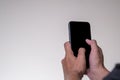 Close up Hand man holding smartphone with black screen  on background Royalty Free Stock Photo