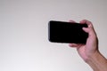 Close up Hand man holding smartphone with black screen  on background Royalty Free Stock Photo