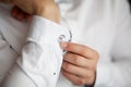 Close up of a hand man how wears white shirt and cufflink