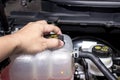 Close up hand a man open cooler tank for check water level Royalty Free Stock Photo