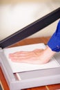 Close up of hand man over the guillotine, working on the guillotine, cutting paper