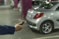 Close up hand a man Press the button of car keys remote for lock and unlock car door Royalty Free Stock Photo