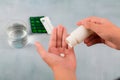 Close up hand man taking pills take a medicine,cup glass of water on table. Stop drug use Taking Medication health care Royalty Free Stock Photo