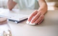 Close up hand man using mouse and computer at home with morning light Royalty Free Stock Photo