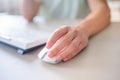 Close up hand man using mouse and computer at home with morning light Royalty Free Stock Photo