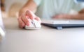 Close up hand man using mouse and computer at home with morning light Royalty Free Stock Photo