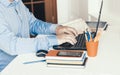 Close-up of hand man using a mouse and typing on laptop on white table, business concept Royalty Free Stock Photo