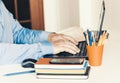 Close-up of hand man using a mouse and typing on laptop on white table, business concept Royalty Free Stock Photo