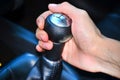 Close up of hand on manual gear shift knob Royalty Free Stock Photo