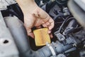 Close up hand of mechanic doing car service and maintenance - Oil and fuel filter changing Royalty Free Stock Photo