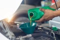 Close up hand mechanic repairing change the Oil. Car mechanic po