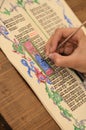 Close-up of hand of medieval manuscript scribe - calligraphy