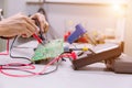 Close up of the hand men hold tool repairs electronics manufacturing Services,Repair of electronic devices, tin soldering parts Royalty Free Stock Photo