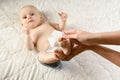 Close-up on the hand of mother and child body-care with focus on clean the baby`s buttock. Happy Family concept. Beautiful Royalty Free Stock Photo